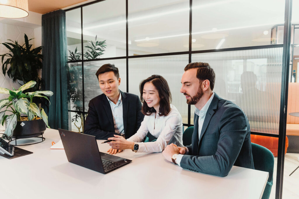 Cloud Capital Team Members Looking at Computer